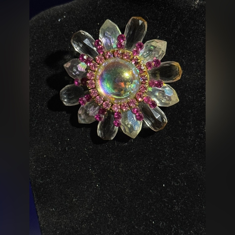 Vintage clip-on floral earrings or starburst design,an aurora borealis finish.